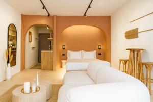 a hotel room with two beds and a couch at Marabou Unique Stay in Thessaloniki +127 photos