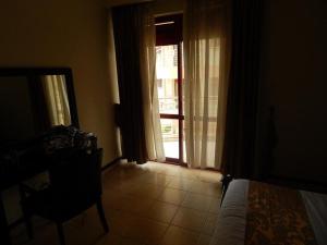 Ένα ή περισσότερα κρεβάτια σε δωμάτιο στο Kacyiru Executive Apartments