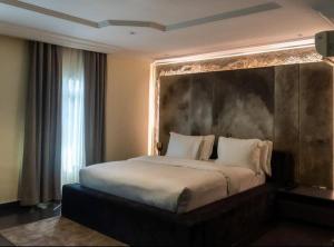 Postel nebo postele na pokoji v ubytování Hiro Lagos