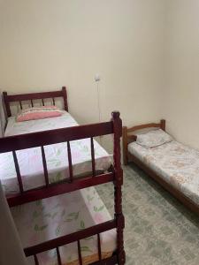 Ένα ή περισσότερα κρεβάτια σε δωμάτιο στο Pousada Moura +6 φωτογραφίες