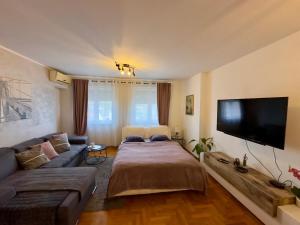 Ένα ή περισσότερα κρεβάτια σε δωμάτιο στο Belgrade Apartment 2