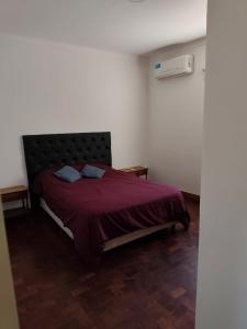 En eller flere senge i et værelse på Depto Centrico en Planta Alta