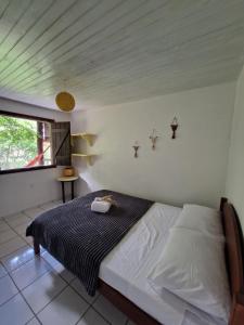 Кровать или кровати в номере Pousada Aconchego do Rosa - Centrinho do Rosa