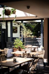 a group of tables and chairs on a patio at The Red Lion in Thames Ditton