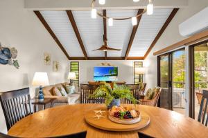 a dining room with a table with a bowl of fruit on it at Wailea Ekolu 1604 · WE 1604 Wailea 2BD Condo w AC Pool Near Beac in Kihei