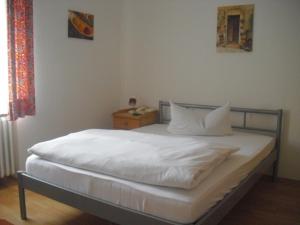 Postel nebo postele na pokoji v ubytování Hotel Feilen-Wolff