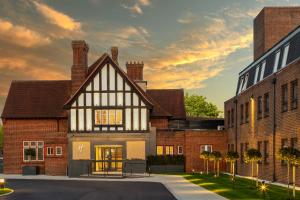 an architectural rendering of a house in front of buildings at Holiday Inn London-Bexley by IHG in Bexley