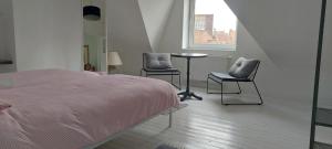 Giường trong phòng chung tại Kleine Dijk