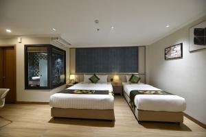 Ένα ή περισσότερα κρεβάτια σε δωμάτιο στο Dong Xuan Boutique Hotel