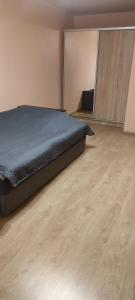 Ένα ή περισσότερα κρεβάτια σε δωμάτιο στο Апартаменти ЖК Тріумф,ЖД ВОКЗАЛ, ОБЛАСНА ЛІКАРНЯ,