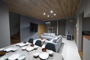 a living room with a table and a couch at Toko92 in Asahikawa