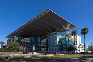 a large glass building with a large roof at Close to the Action, Peaceful When You Return in Orlando