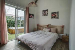 Ένα ή περισσότερα κρεβάτια σε δωμάτιο στο Villa aux portes de l'Océan +10 φωτογραφίες