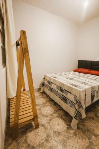 Postel nebo postele na pokoji v ubytování Suíte Praia dos Anjos