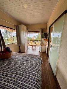 Ένα ή περισσότερα κρεβάτια σε δωμάτιο στο Mirante - Chalé Pura vida