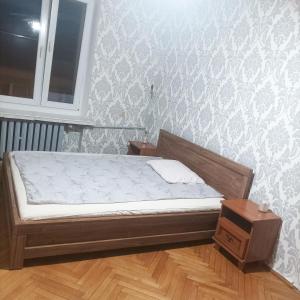 Una cama o camas en una habitación de Gościnne Gniazdo Centrum