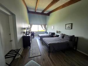 a bedroom with two beds and a window at Scenic Lakeside Getaway with Lake Views Near Gunstock & Weirs Beach | Laconia, NH in Weirs Beach