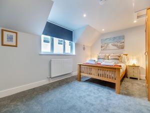 Ένα ή περισσότερα κρεβάτια σε δωμάτιο στο Nest Holiday Home