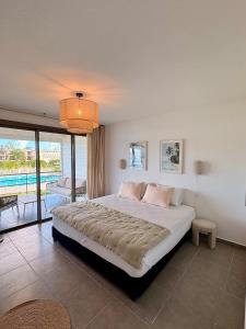 Ένα ή περισσότερα κρεβάτια σε δωμάτιο στο Infinity View Beach House, 2 bdr