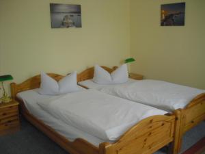 Postel nebo postele na pokoji v ubytování Hotel Feilen-Wolff