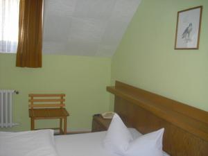 Postel nebo postele na pokoji v ubytování Hotel Feilen-Wolff