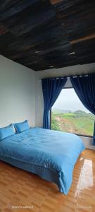 Ένα ή περισσότερα κρεβάτια σε δωμάτιο στο Homestay Chù Chỏ