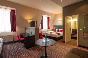 Ένα ή περισσότερα κρεβάτια σε δωμάτιο στο Seehotel Brandenburg an der Havel