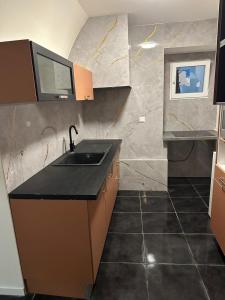 Η κουζίνα ή μικρή κουζίνα στο Sympathique T3