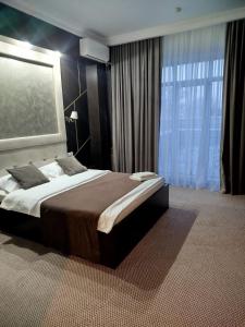 Postel nebo postele na pokoji v ubytování Гостиница SHAHRISTAN