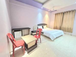 Ένα ή περισσότερα κρεβάτια σε δωμάτιο στο Collection O Ajara Amboli Ghat Formerly Hotel Paradise