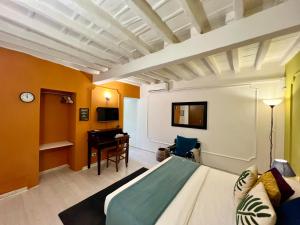 a bedroom with a bed and a desk in a room at Charming Navona in Rome