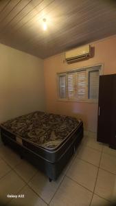 Ένα ή περισσότερα κρεβάτια σε δωμάτιο στο Casa a Grande Família