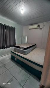 Ένα ή περισσότερα κρεβάτια σε δωμάτιο στο Casa a Grande Família