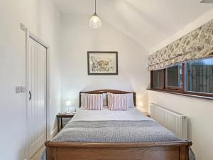 Ένα ή περισσότερα κρεβάτια σε δωμάτιο στο Daveys Barn Brendon Hill