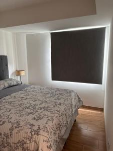 Postel nebo postele na pokoji v ubytování Modern Apartment in Zone 9