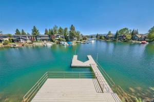 a dock in the middle of a lake with boats at 2030 Marconi Way home in South Lake Tahoe