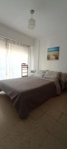 Postel nebo postele na pokoji v ubytování Tu dpto en Mardel