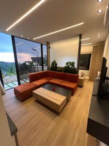 a living room with a couch and a coffee table at Sunheaven resort in Al Qarşā