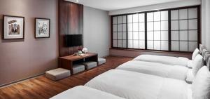 Katil atau katil-katil dalam bilik di Orange Hotel - Wenhua, Chiayi