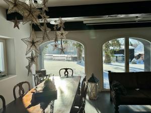 a dining room with a table with stars on the wall at Rest & Relax Doubice in Doubice