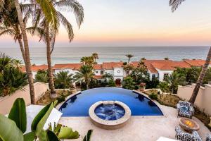 a view of the ocean from the balcony of a house at Villa Pura Vida in San José del Cabo
