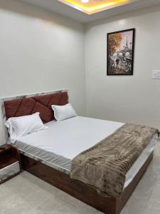 Ένα ή περισσότερα κρεβάτια σε δωμάτιο στο Hotel Star Eleven