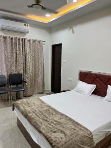 Ένα ή περισσότερα κρεβάτια σε δωμάτιο στο Hotel Star Eleven