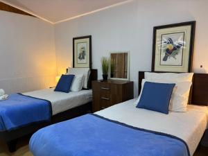 Ένα ή περισσότερα κρεβάτια σε δωμάτιο στο De la Plaza Rent a Home