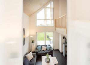 Χώρος καθιστικού στο Dock 61 - tolles Ferienhaus für bis zu 4 Personen mit Kaminofen und Sauna - Haustiere herzlich willkommen, direkt am Wasser gelegen