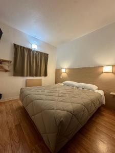 Postel nebo postele na pokoji v ubytování Première Classe Rennes sud Est