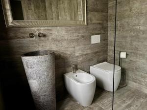 a bathroom with a toilet and a bidet at Rest & Relax Doubice in Doubice +50 photos