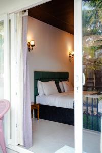 Ένα ή περισσότερα κρεβάτια σε δωμάτιο στο Orange Sky Inn