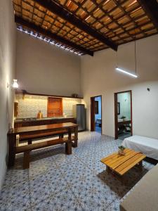 a room with a pool table and a bench at Lyttos Bungalows in Icapuí