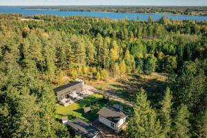 an aerial view of a house in the woods at Stuga på ö / närhet till vatten in Mariestad